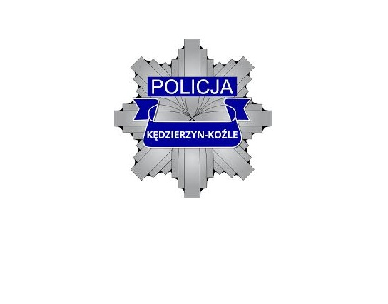 zdjęcie kolorowe: policyjna odznaka z napisem Kędzierzyn - Koźle